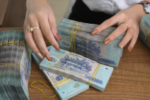 Vietnam central bank cuts rates for first time in two years