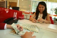 Vietnam dong devaluation inevitable, good for economy