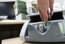 Dollar inches up against dong